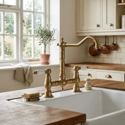 brass-kitchen-faucet-with-white-handles